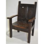 An Antique carved and panelled oak Wainscot chair