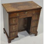 A 19th century walnut kneehole desk in Georgian st