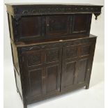 An Antique carved and panelled oak court cupboard,