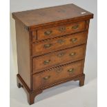An early 20th century reproduction walnut chest of