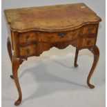 Early 20th century walnut side table with shaped f