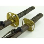 A pair of reproduction Japanese swords and scabbar