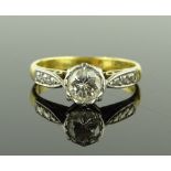 An 18ct gold solitaire diamond ring, central diamo