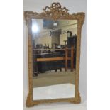 An ornate 19th century gilt gesso framed wall mirr