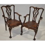 A pair of Chippendale style mahogany elbow chairs