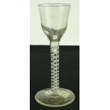 An 18th century cordial glass with milk twist stem