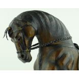 A leather covered ornamental horse, height 66cm.