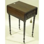 A 19th century mahogany drop leaf sewing table on