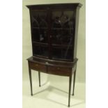 An Edwardian mahogany bow front display cabinet on