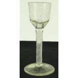 An 18th century cordial glass with milk twist stem