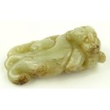 A Chinese carved jade reclinin mythical beast, len