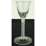 An 18th century cordial glass with milk twist stem