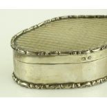 An Edwardian oval silver box with cast bands, Birm