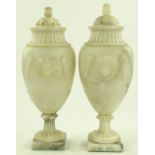 A pair of French early 19th century alabaster urns