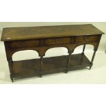 A 19th century oak dresser base, 3 frieze drawers