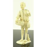 A Japanese Meiji period carved ivory figure, a pum