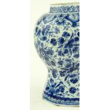 An 18th century Delft pottery vase, hand painted b