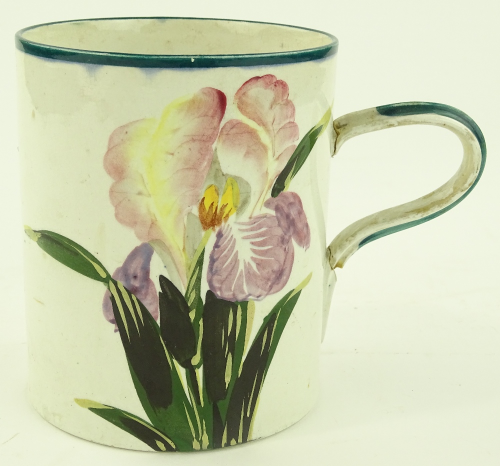 A large Wemyss pottery mug with hand painted iris