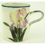 A large Wemyss pottery mug with hand painted iris