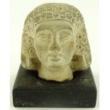 An Ancient Egyptian carved limestone female head,