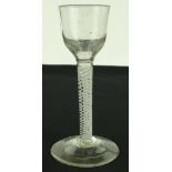 An 18th century cordial glass with milk twist stem