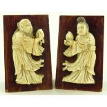 A pair of Chinese stained wood bookends with carve