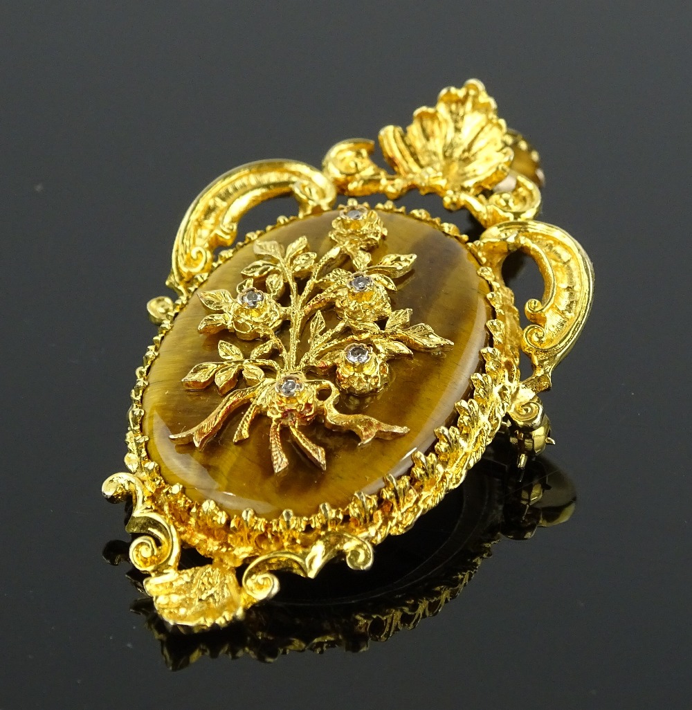 An ornate 9ct gold tiger's eye and diamond set pen