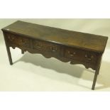 A George III oak and mahogany crossbanded dresser