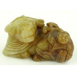 A Chinese russet and white jade carving, buffalo a