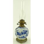 A Chinese blue and white porcelain oil lamp on bro