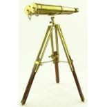 A pair of reproduction brass binoculars on brass a