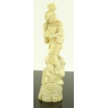 A Japanese Meiji period carved ivory figure, boy h