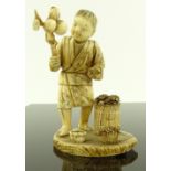A Japanese Meiji period ivory carving, child with