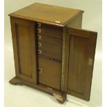 A Victorian light oak 2-door silver cupboard with