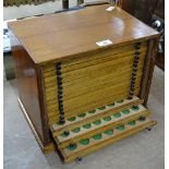 A coin collector's chest of drawers