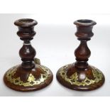 A pair of Victorian walnut candlesticks with brass