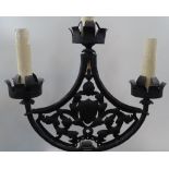 A Antique wrought-iron floor standing candle holde