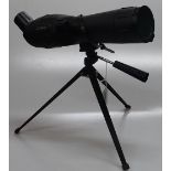 A modern spotting scope on tripod, 20-60x60