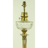 A Victorian onyx oil lamp with gilt brass and cham