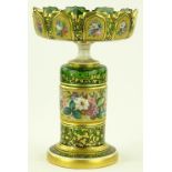 An ornate 19th century Bohemian green overlay glas