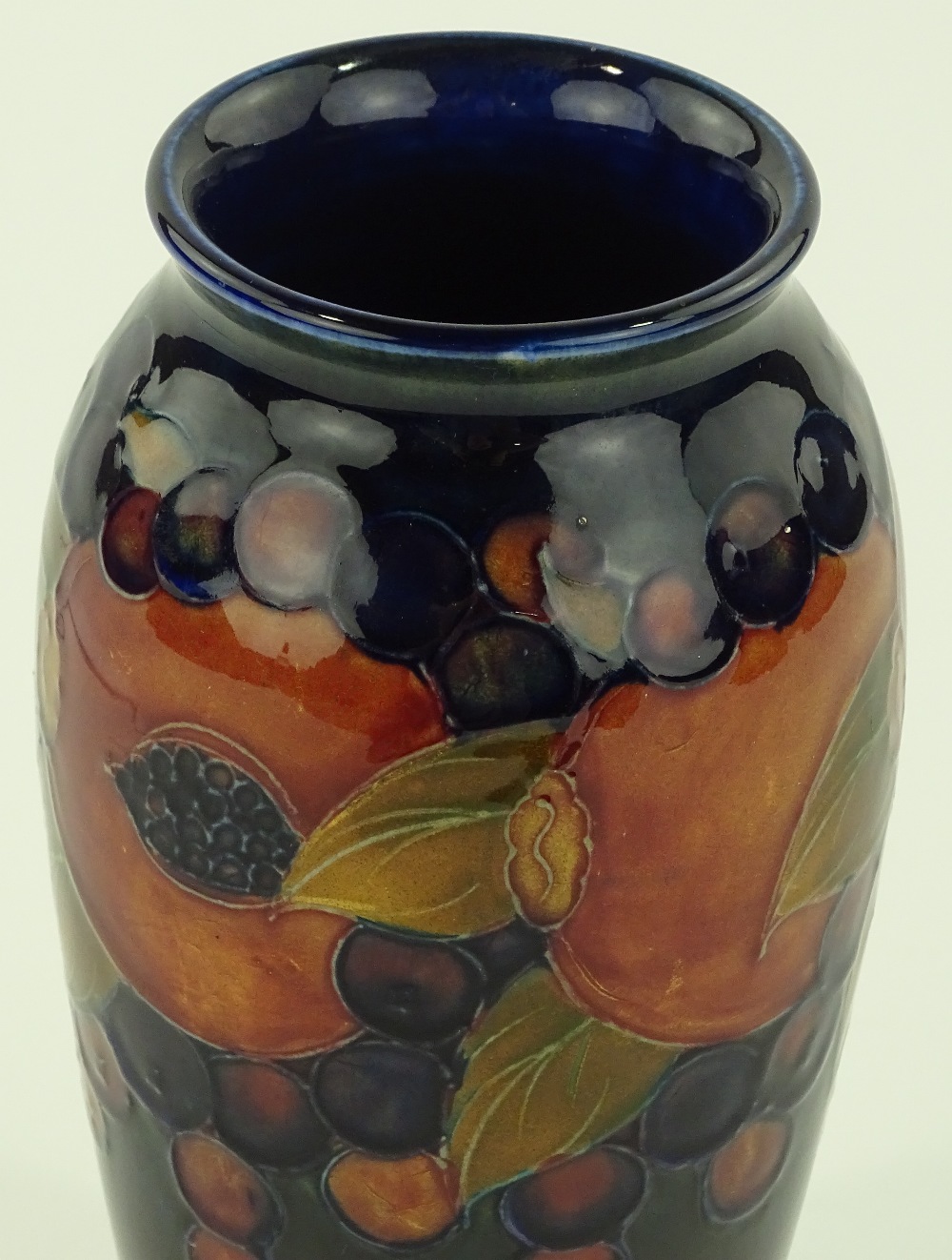 A Moorcroft pomegranate design vase, signed under