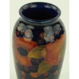 A Moorcroft pomegranate design vase, signed under