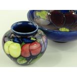 A Moorcroft orchid design bowl, diameter 15cm, and