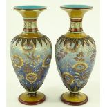 A pair of Doulton Lambeth vases, painted and gilde