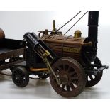 A live steam powered model of Stephenson's Rocket,