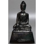 WITHDRAWN An Oriental unmarked white metal, seated Buddha, w