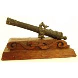 A 19th century patinated bronze table cannon, leng