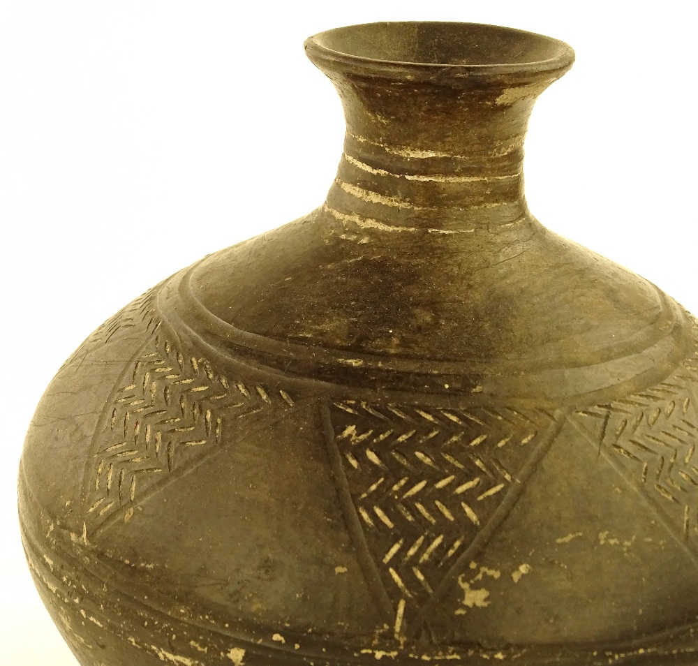 An Ancient Greek pottery vase with incised geometr