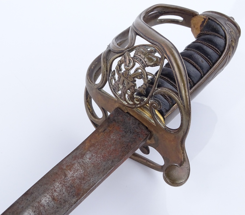 A George IV military sword, pierced brass basket h