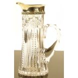 An American cut-glass jug with sterling silver rim